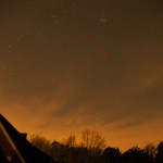 Wide-angle view with the comet encircled in red